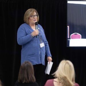 Lorrie speaking at event