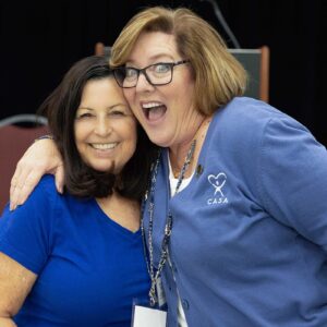 Lorries smiles in group photo